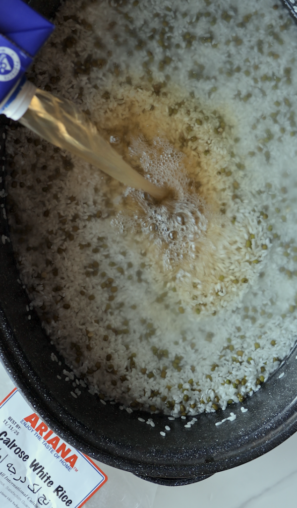 adding beef broth to the Calrose rice and mung beans